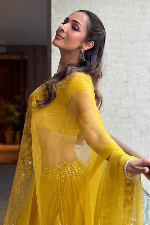 Malaika Arora in Mustard Yellow Embroidered Cotton Silk Satin Lehenga Set