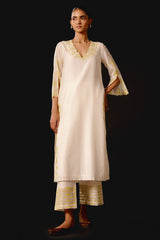 Rashmika Mandanna in Ivory Yellow Chanderi Kurta Set with Cutwork Embroidery